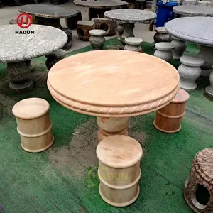 Tavolo rotondo in marmo di pietra naturale intagliato a mano da giardino all'aperto con sedili per panca per sedie
