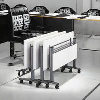 Bureau d'écriture modulaire moderne, élégant et fonctionnel, avec panneaux et roulettes incluses pour un gain de place, idéal pour l'école, le bureau ou la salle de formation.