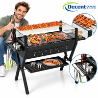 Barbecue portable au charbon de bois avec pare-vent en verre, support à brochettes, étagère latérale et aérations latérales pour camping et extérieur