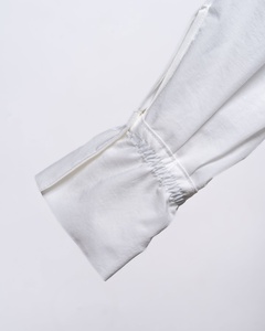 Chemise décontractée blanche pour femme OOTD 2026, style simple et tendance, manches longues, boutonnage simple, décoration boutonnée sur le devant, idéale pour le bureau. - Product Image 6