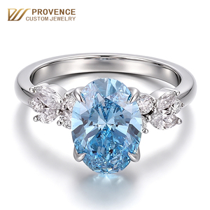 Anillo de compromiso de platino 950 con diamante azul vivo ovalado de laboratorio, engastado en puntas, de la marca Provence Jewellery, para novia. - Product Image 1