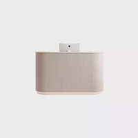 Comptoir de caisse pour magasin de vêtements, petit salon commercial, comptoir de bar de luxe, réception minimaliste moderne à façade arrondie