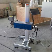 Machine de codage laser en ligne industrielle pour la date de péremption et l'impression de la date de production pour les bouteilles en PET automatique