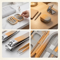 Kit de manucure orange et gris avec coupe-ongles, ciseaux à ongles, fourche à cuticules, pince à épiler et lime à ongles dans un étui de voyage