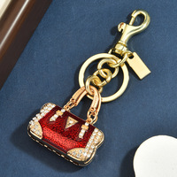 Pembuka Botol Gantungan Kunci LOGO Grosir Berhias Berlian Tas Mini Multi-Warna Liontin Paduan Tetesan Minyak Bentuk Bintang Elegan