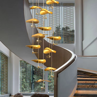 Lustre moderne de luxe en cristal et cuivre doré à LED pour plafonds hauts, escaliers en colimaçon, halls d'entrée et halls d'hôtel