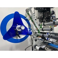 Machine d'étiquetage automatique horizontale haute efficacité pour bouteilles rondes, destinée aux boissons, aux cosmétiques et aux emballages d'usage quotidien