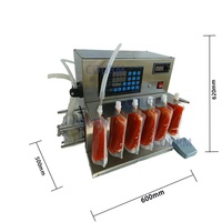 Pompe péristaltique de table semi-automatique Machine de remplissage de sacs verticaux à 6 buses liquide haute température miel gelée lait de soja