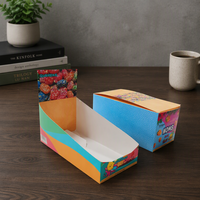 Boîtes de présentation en carton ondulé sur mesure de haute qualité, à poser sur comptoir, avec système de déchirement, pour chocolats, bonbons et gommes.
