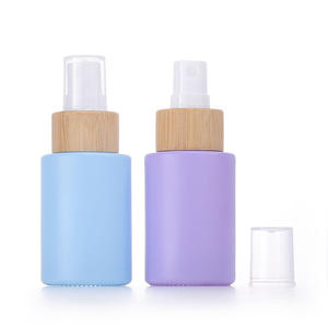 Tapas de bambú WeWood de Vietnam y tapas de bomba de rociador de niebla Embalaje de botellas de aceite esencial cosmético ecológico - Product Image 1