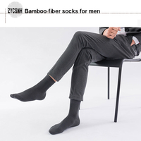 XIANGHUI Vente en gros Chaussettes pour hommes d'affaires Chaussettes boîte noire Logo Chaussettes en bambou biologique personnalisées