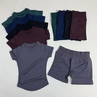 Ensemble de yoga 2 pièces extensible pour femme : haut court à col rond et manches courtes, short d'entraînement taille haute, sans couture, uni, anti-plis