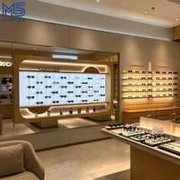 Vitrine d'exposition personnalisée pour magasin d'optique, présentoir mural en bois rétroéclairé par LED pour lunettes, étagère de vente au détail pour lunettes de soleil, pour magasin d'optique, centre commercial, kiosque