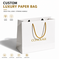 Sacs en papier de luxe personnalisés avec logo imprimé en feuille d'or, emballage pour le shopping, poignée robuste, écologiques, fournisseur en gros pour la vente au détail