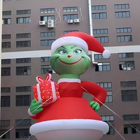 Ballon gonflable géant Zhenmei de 50 pieds, monstre vert Grinch, avec ventilateur intégré et installation facile, tenant une boîte cadeau