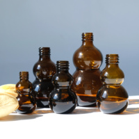 Bouteille d'huile essentielle en verre de gourde de couleur personnalisée bouteille de parfum