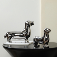 Statue de chien en céramique argentée, sculpture minimaliste de teckel, ornement décoratif artisanal pour étagère de maison ou de bureau
