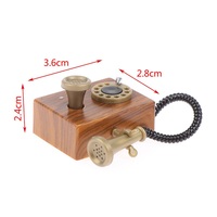 Téléphone rotatif miniature vintage à l'échelle 1:12, accessoire pour maison de poupée, décoration rétro en plastique, pour collectionneurs et enfants