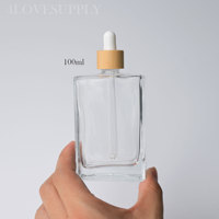 Flacon compte-gouttes carré en verre transparent de 15 ml, 30 ml, 50 ml, 100 ml avec bouchon en bambou naturel, rechargeable, pour huiles, ensembles écologiques en gros