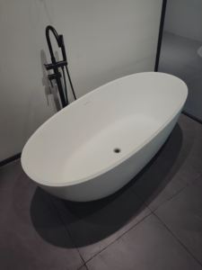 Bañera Moderna y Confortable de Piedra Artificial, Superficie Sólida, Independiente, para Baño Interior, Forma Ovalada, con Desagüe - Product Image 4