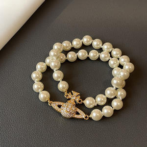 Bracelet classique pour femme Vivienne Empress Dowager, double rang de perles, fermoir magnétique Saturne, plaqué or, perles en forme de cœur - Product Image 2