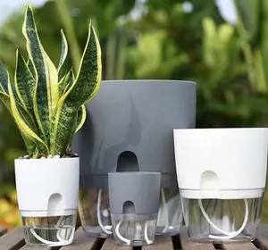 Pianta a strati a buon mercato all'ingrosso, vasi per fioriere autoirriganti in vaso con contenitore per l'acqua fioriera decorativa rotonda per vasi da fiori/