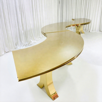 Table de salle à manger de luxe moderne en acier inoxydable avec plateau en verre trempé, design serpentin en S doré, pour hôtels et événements extérieurs, durable