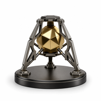 Trophée en métal en forme de capsule en laiton plaqué or, avec ouverture révélant une sphère noire sculptée à la main, trophée personnalisé pour cadeaux de bienvenue