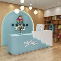 XTQT-052 Modern Ofis Resepsiyon Masası Küçük Pembe Lüks Melamin Levha Tam Kenar Kaplama Dayanıklı Yüksek Maliyet Performanslı Otel İçin