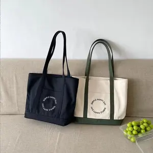 تصميم جديد حقيبة حمل صغيرة من القماش الكتاني مزودة بجيب وسميكة قابلة للتعديل بشعار حسب الطلب
