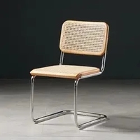 Chaise de salle à manger confortable de style mid-century moderne en fer et rotin avec coussin en cuir pour hôtel et appartement