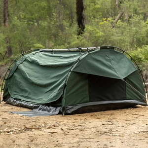 Two-person foldable canvas tent set up on gravel with aluminum poles and guy lines