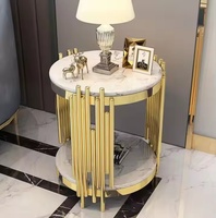 Table basse moderne de luxe en fibre de verre dorée avec base en acier inoxydable Meubles de salon Table d'appoint pour hôtels et villas