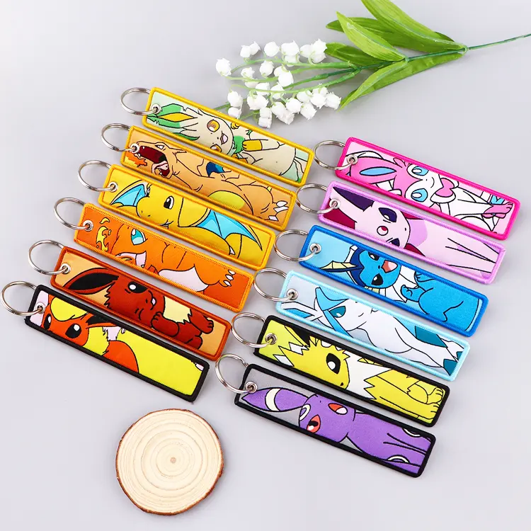 Promotional personalized anime flight tag keychains double side embroidery custom logo woven fabric keychain