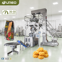 Machine d'emballage inclinée à chauffage quatre côtés avec disque de tri et peseuse à 10 têtes pour snacks fragiles, biscuits et aliments soufflés.