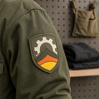 Logo en silicone personnalisé OEM pour vêtements de travail, emblème tissé en relief pour uniforme d'entreprise, fabricant de badges 3D en relief