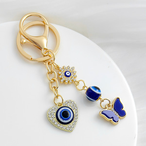 Nouveau porte-clés créatif en strass avec symbole porte-bonheur, œil protecteur, plaqué or, breloque cœur œil bleu pour la protection et la décoration de sac - Product Image 2