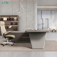 Bureau de direction moderne avec pied trapézoïdal incliné, éclairage LED cyan et armoire latérale pour bureau