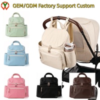 Sac à dos à couches multifonctionnel personnalisé d'usine OEM avec matelas à langer, fixation pour poussette, pochette pour bagages, sac de voyage élégant pour bébé