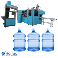 Machine de soufflage de seaux d'eau de 5 gallons entièrement automatique et contrôlée par PLC pour conteneurs d'eau potable en PET, haute performance et robuste