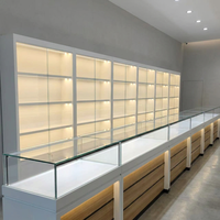 Solution d'affichage intérieur pour bijouterie tout-en-un : Vitrine murale LED pour bijoux, comptoir de présentation en verre avec tiroir de rangement