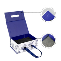 Boîte en papier pliable haut de gamme durable avec poignée, découpe personnalisée et marquage à chaud pour emballage cadeau de festival type valise