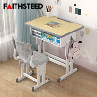 Ensemble bureau et chaise pour enfants avec dossier à motif ondulé et trous de réglage en hauteur pour l'étude scolaire