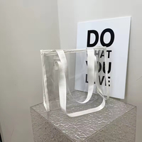 Sac fourre-tout transparent en PVC avec logo personnalisé, vente en gros d'usine, sac fourre-tout transparent en PVC imperméable et tendance avec poignée épaissie
