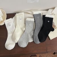 Chaussettes décontractées mi-mollet en coton/élasthanne tricotées, style printemps tendance, douces et confortables pour femme, avec logo, vente en gros directe usine