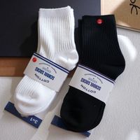 Chaussettes en coton pour enfants en gros, chaussettes durables de couleur unie pour garçons et filles, prix d'usine, vente en gros pour les importateurs des marchés européens, américains et africains
