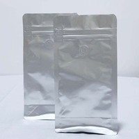Sac de café en feuille d'aluminium argentée imprimée personnalisée avec valve respirante unidirectionnelle conception réutilisable sac vertical à fermeture éclair papillon