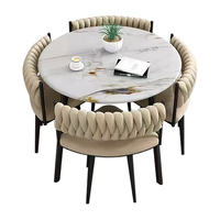 Meubles de salle à manger modernes, table ronde avec structure en fer et chaises, plateau en marbre, pour petit appartement