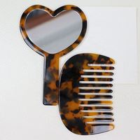 Mignon peigne à cheveux portable en acétate vintage en forme de cœur avec miroir intégré pour femmes