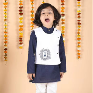 Adorable little <b>boy</b> in navy blue <b>kurta</b> with white waistcoat and pajama festive ethnic outfit front pose smiling child - Product Image 1